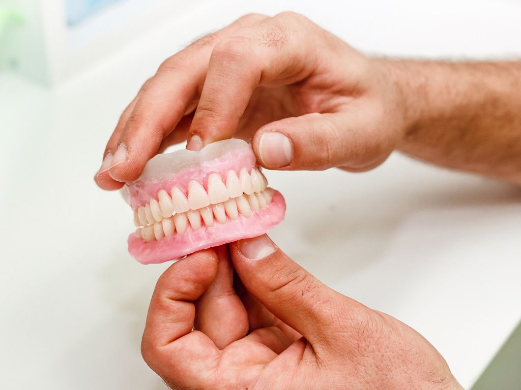 snap in dentures vs implants